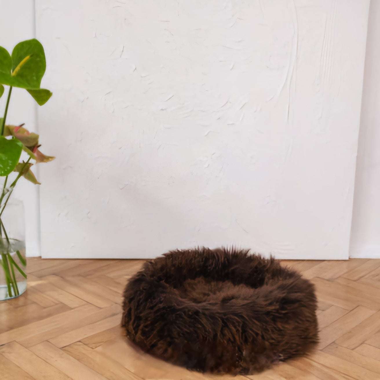 Round handmade dog cushion with natural long sheepskin filling in taupe shade, dark brown color, eco-friendly, for pets.