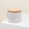 Leckerlie Dose with cork closure on white surface.